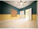 An empty bedroom with tile flooring and a ceiling fan at 2485 Huron Cir, Kissimmee, FL 34746