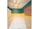 Bedroom with teal and yellow walls and tile floors at 2485 Huron Cir, Kissimmee, FL 34746