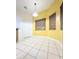 Sunlit breakfast nook with tiled floor and neutral walls at 2485 Huron Cir, Kissimmee, FL 34746