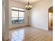 Bright dining room with tile floors and chandelier at 2485 Huron Cir, Kissimmee, FL 34746