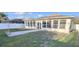 Single-story home with a large sunroom and fenced backyard at 2485 Huron Cir, Kissimmee, FL 34746