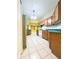 View of a kitchen with wood cabinets and green countertops at 2485 Huron Cir, Kissimmee, FL 34746