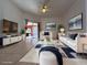 Bright living room with stylish white furniture, neutral walls, and sliding glass doors to the outdoor living area at 2485 Huron Cir, Kissimmee, FL 34746