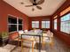 An outdoor patio featuring multiple windows, ceiling fan and tile floor at 2485 Huron Cir, Kissimmee, FL 34746