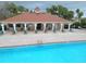 The community pool and lounge area offer a relaxing retreat, surrounded by well-maintained landscaping at 2485 Huron Cir, Kissimmee, FL 34746