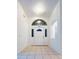 Bright and airy entryway with tile flooring and an arched window at 2485 Huron Cir, Kissimmee, FL 34746