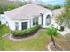 Single-story house with a landscaped yard and a curved driveway at 2485 Huron Cir, Kissimmee, FL 34746