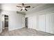 Spacious bedroom with wood-look floors, large closet, and ensuite bathroom at 3625 Lone Pine Dr, Orlando, FL 32822