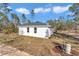 Spacious backyard with open lawn, offering privacy and potential for outdoor activities and customization at 406 Nw Narcissus Rd, Dunnellon, FL 34431