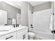 Bathroom with a single sink vanity, granite countertops, and a shower and bath tub at 406 Nw Narcissus Rd, Dunnellon, FL 34431