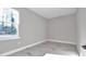 A bedroom boasts a neutral wall color, beautiful views, and natural light at 406 Nw Narcissus Rd, Dunnellon, FL 34431