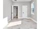 Spacious bedroom with neutral walls, faux-wood flooring, and bright light at 406 Nw Narcissus Rd, Dunnellon, FL 34431