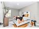 Bright bedroom featuring a decorative bed with stylish pillows and unique accent decor at 406 Nw Narcissus Rd, Dunnellon, FL 34431