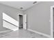 This bedroom features neutral walls and light grey faux-wood floors at 406 Nw Narcissus Rd, Dunnellon, FL 34431