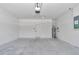 Clean and spacious garage features a new automatic door and space for two cars and storage at 406 Nw Narcissus Rd, Dunnellon, FL 34431