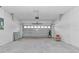 Spacious garage with an automatic door opener, ample space for vehicles and storage at 406 Nw Narcissus Rd, Dunnellon, FL 34431