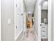 This hallway features faux-wood floors and bright white trim at 406 Nw Narcissus Rd, Dunnellon, FL 34431