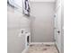 Functional laundry room features storage shelving and washer/dryer hook-ups with clean lines at 406 Nw Narcissus Rd, Dunnellon, FL 34431