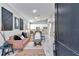 Open-concept living room featuring modern furnishings, decor, and seamless flow into the kitchen area at 406 Nw Narcissus Rd, Dunnellon, FL 34431