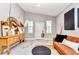 Cozy living room featuring stylish decor and a comfortable leather sofa and wood-look flooring at 406 Nw Narcissus Rd, Dunnellon, FL 34431