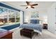 Bedroom with blue walls, a king-size bed and backyard view at 483 Douglas Edward Dr, Ocoee, FL 34761