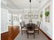 Bright dining area with a round table and chair set, hardwood floors and decorative wall accents at 483 Douglas Edward Dr, Ocoee, FL 34761