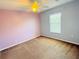 This cozy bedroom features soft carpet, a ceiling fan and a bright window to let the sunshine in at 5014 Wise Bird Dr, Windermere, FL 34786