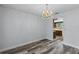 Dining area with kitchen access and modern flooring at 712 Alfred Dr, Orlando, FL 32810