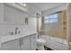 Updated bathroom with white vanity and a tub shower combo at 842 E Church Ave, Longwood, FL 32750