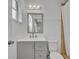 Updated bathroom with gray vanity and a shower at 842 E Church Ave, Longwood, FL 32750