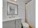 Updated bathroom with gray vanity and a shower at 842 E Church Ave, Longwood, FL 32750