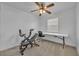 Bright bedroom with ceiling fan, carpeted floors, and home office setup at 842 E Church Ave, Longwood, FL 32750