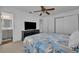 Main bedroom with ceiling fan, ensuite bathroom access and neutral decor at 842 E Church Ave, Longwood, FL 32750
