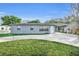 Newly painted 1 story home with a carport and landscaped lawn at 842 E Church Ave, Longwood, FL 32750