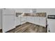 White cabinets, new appliances, and mosaic backsplash at 842 E Church Ave, Longwood, FL 32750