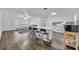 Modern white kitchen with an island and breakfast bar at 842 E Church Ave, Longwood, FL 32750