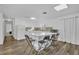 Modern white kitchen with an island and breakfast bar at 842 E Church Ave, Longwood, FL 32750