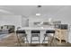 Modern white kitchen with an island and appliances at 842 E Church Ave, Longwood, FL 32750