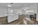Open concept living and kitchen area with wood-look floors at 842 E Church Ave, Longwood, FL 32750