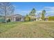 Spacious backyard with home and screened patio at 14157 Creekbed Cir, Winter Garden, FL 34787