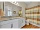 Bathroom with shower/tub, toilet, and vanity with tan countertop at 14157 Creekbed Cir, Winter Garden, FL 34787