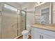 Bathroom with shower, toilet and vanity with tan countertop at 14157 Creekbed Cir, Winter Garden, FL 34787