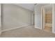 Spacious bedroom with carpet, door to bathroom, and window at 14157 Creekbed Cir, Winter Garden, FL 34787