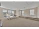 Spacious bonus room with a ping pong table and large windows at 14157 Creekbed Cir, Winter Garden, FL 34787
