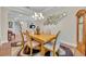 Formal dining room with wooden table and chandelier at 14157 Creekbed Cir, Winter Garden, FL 34787