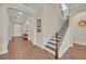 Bright and airy entryway with hardwood floors and staircase at 14157 Creekbed Cir, Winter Garden, FL 34787