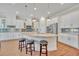 Modern kitchen with white cabinets and granite island at 14157 Creekbed Cir, Winter Garden, FL 34787