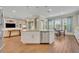 Kitchen island with seating and stainless steel dishwasher at 14157 Creekbed Cir, Winter Garden, FL 34787