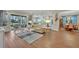 Open living space with hardwood floors and view of backyard at 14157 Creekbed Cir, Winter Garden, FL 34787