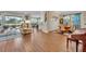 Open living area showcasing hardwood floors and kitchen at 14157 Creekbed Cir, Winter Garden, FL 34787